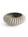 Shiwa vase by Poltrona Frau shown in a low round profile highlighting its circular form, vertical ribbing and sculptural finish.