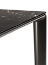 Detailed view of the table leg and underside showing the slim profile and precise construction