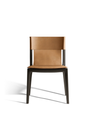 Front-facing studio view of the chair highlighting its clean lines and balanced proportions