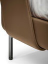 Rear corner detail of the Coupé bed highlighting the curved back of the headboard and smooth upholstery
