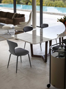 Dining table styled with Montera Mas chairs, illustrating their elegant silhouette and integration within a modern interior setting