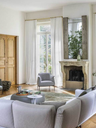 Archibald armchairs by Poltrona Frau placed in an elegant interior space demonstrating versatility and sculptural presence
