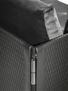 Detail of the Clayton sofa by Poltrona Frau showing the armrest and woven side panel structure