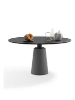 Mesa round table shown with a circular top and central pedestal base, emphasizing balanced proportions and minimal design