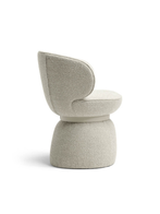 Standalone view of the Leplì small armchair highlighting its rounded base and enveloping upper section designed for comfortable occasional seating