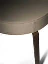 Detailed view of the table edge and leg showing the connection between the top and the support with precise construction