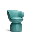 Angled view of the Leplì small armchair showing the curved backrest wrapping around the seat and the solid base beneath, highlighting its soft geometry and supportive form