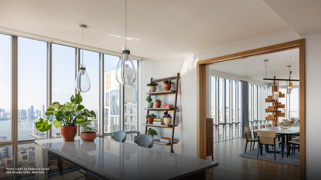Soffi Lamp by Poltrona Frau designed by GamFratesi displayed within a modern interior highlighting the elegant suspension lamp lighting a kitchen island