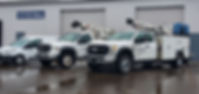 white service van and two crane trucks.