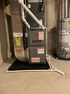 Furnace and water heater in a basement. Haisma Heating & Cooling system.