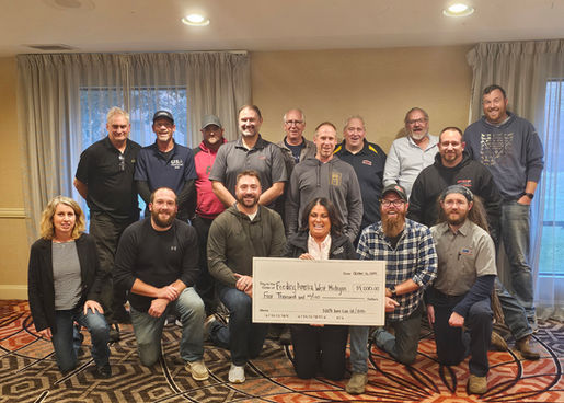 group of people with a check