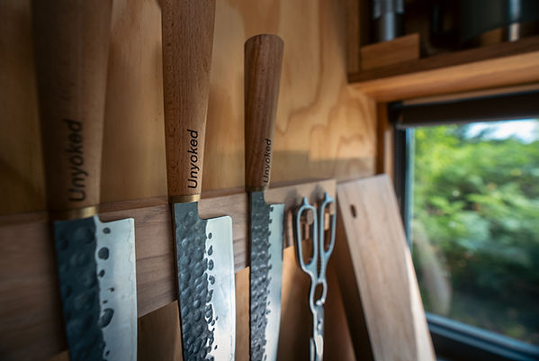 Close up of Unyoked branded knives in cabin