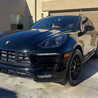 Black Porsche Macan SUV with a clean, glossy finish after professional detailing by More Imagination Auto Detailing.