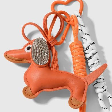 Miniaturbild: Schlüssel-  und Taschenanhänger Dackel, orange