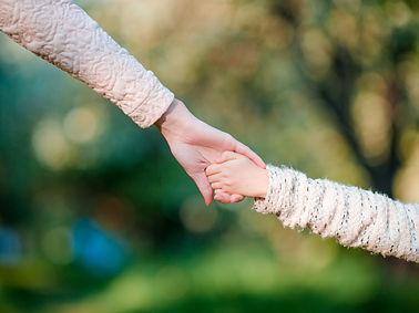 young-parent-holds-the-hand-of-a-small-kid-2025-02-11-15-42-44-utc.jpg