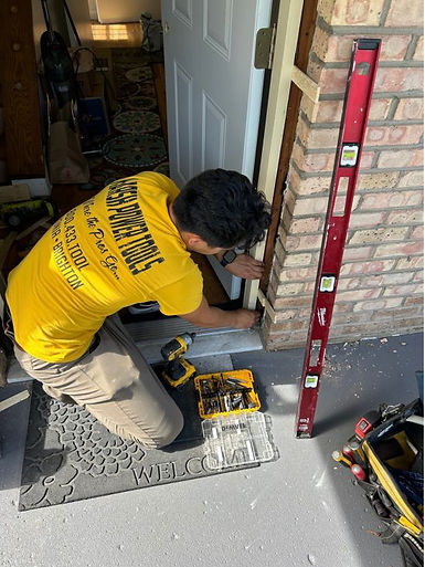 Mark middleton, the owner and handyman of MPS contracting replacing a door frame.