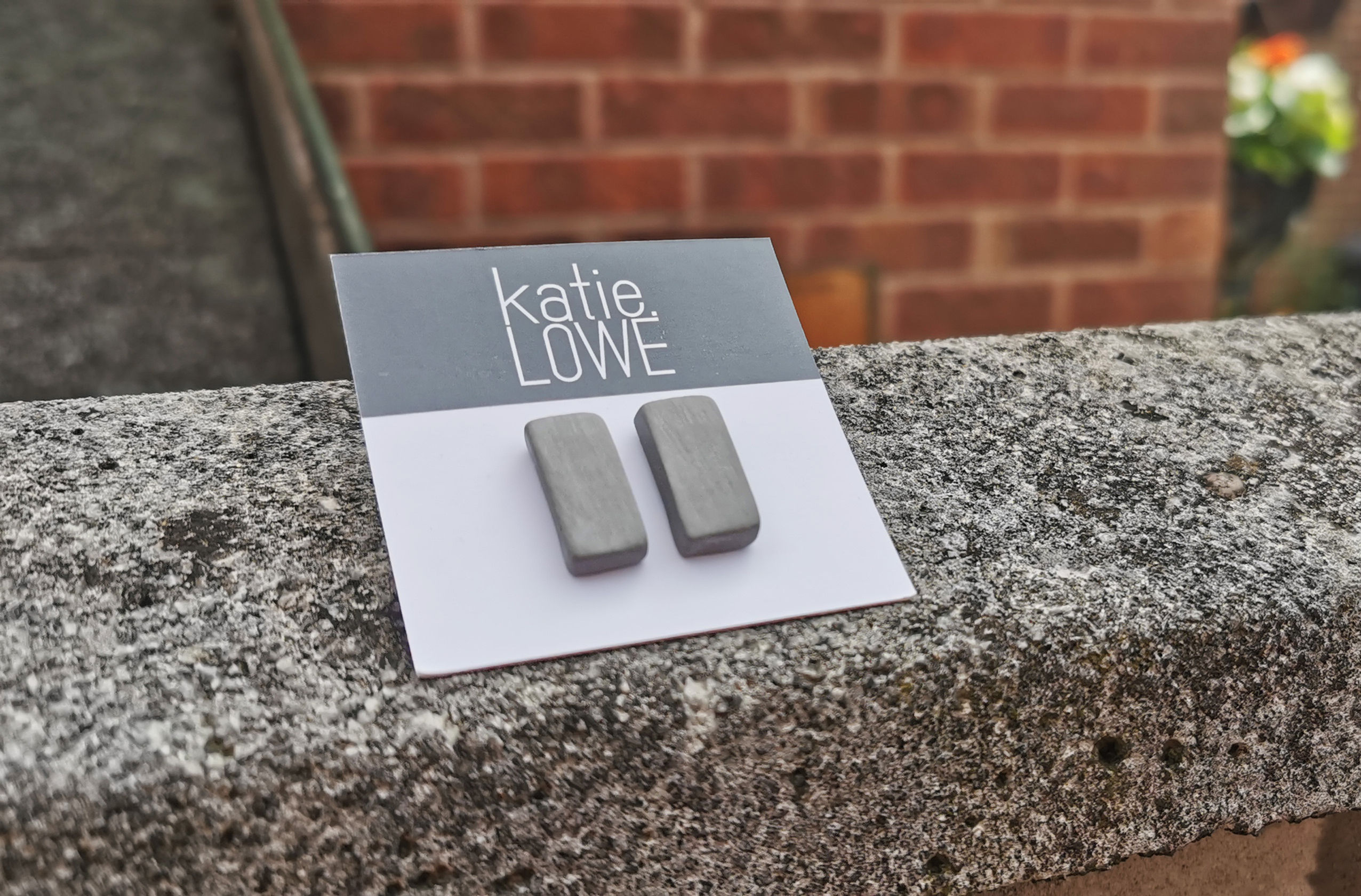 rectangle grey stud earrings.