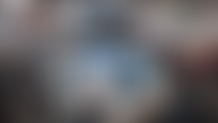 Panoramic view of the bustling MIPCOM 2025 exhibition floor in the Palais des Festivals, Cannes, with attendees networking and diverse content booths on display.