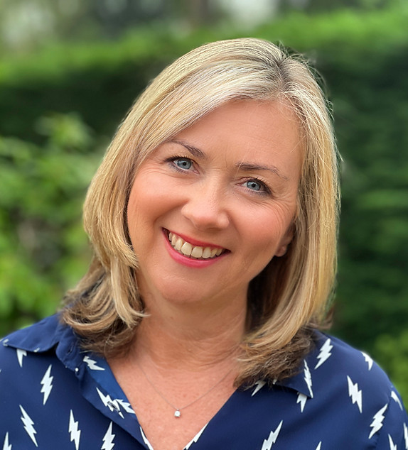 A portrait of Joanne, showing her smiling
