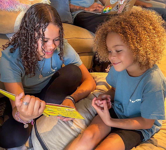 volunteer reading book to child.jpg