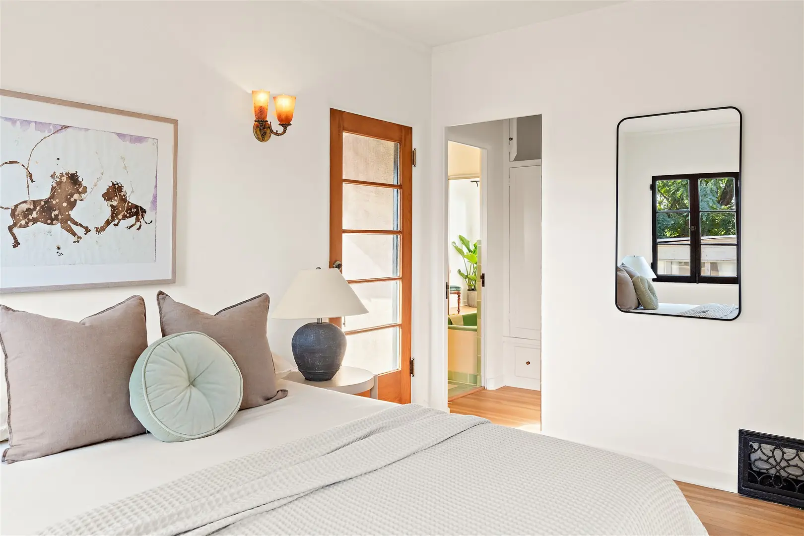 Bedroom with restored windows and hardwood floors at 1239 Geneva Street