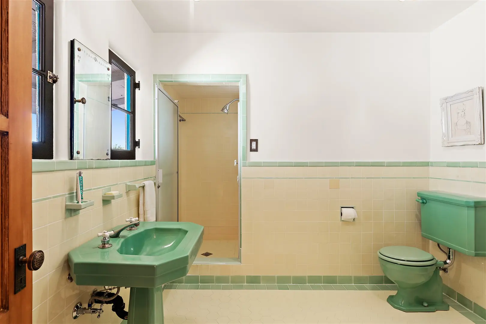 Restored green tile bathroom with period fixtures at 1239 Geneva Street