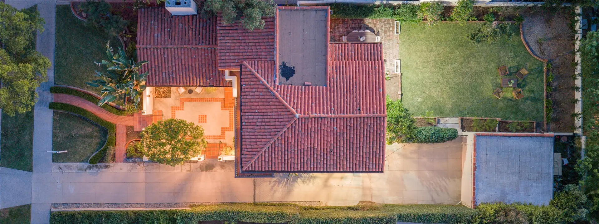 Terracotta floor pattern beside an original wood door at 1239 Geneva Street