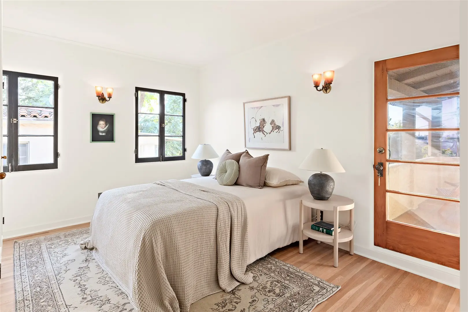 Bedroom with restored windows and hardwood floors at 1239 Geneva Street