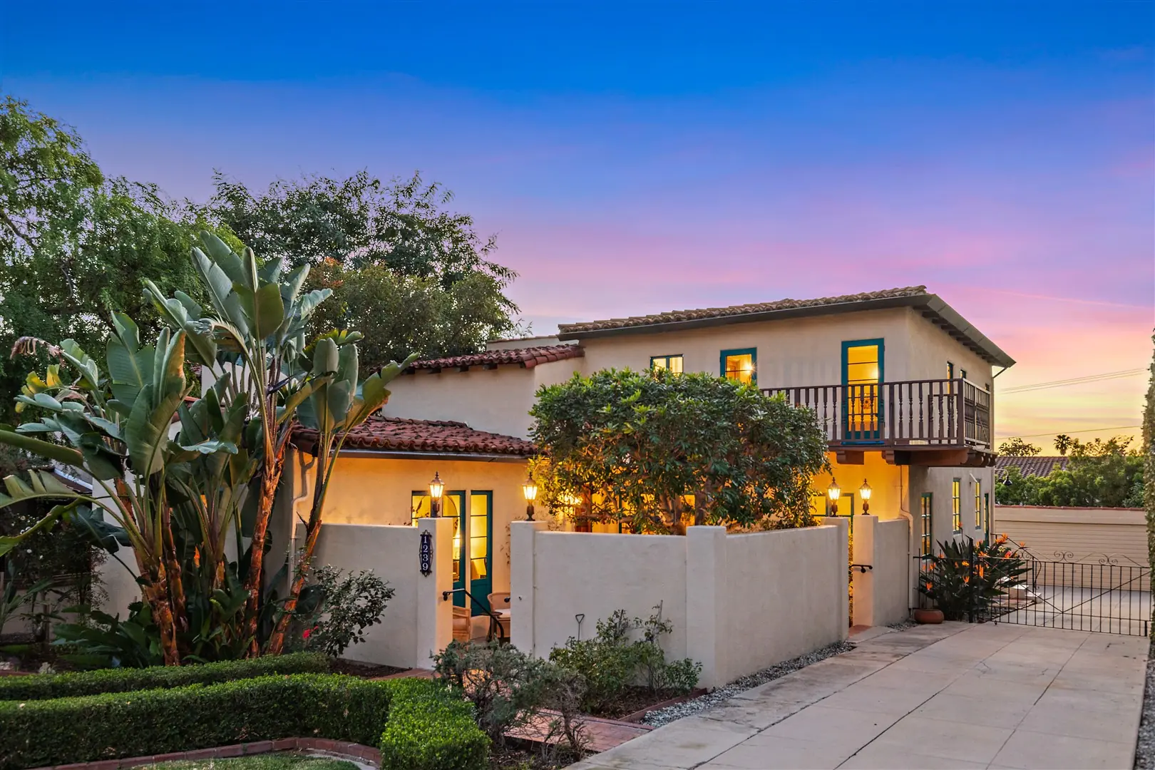 Illuminated courtyard exterior at 1239 Geneva Street in Glendale at dusk