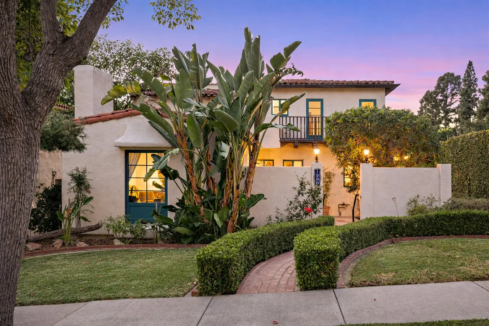 Dusk front exterior of the 1930 Spanish Revival home at 1239 Geneva Street in Glendale