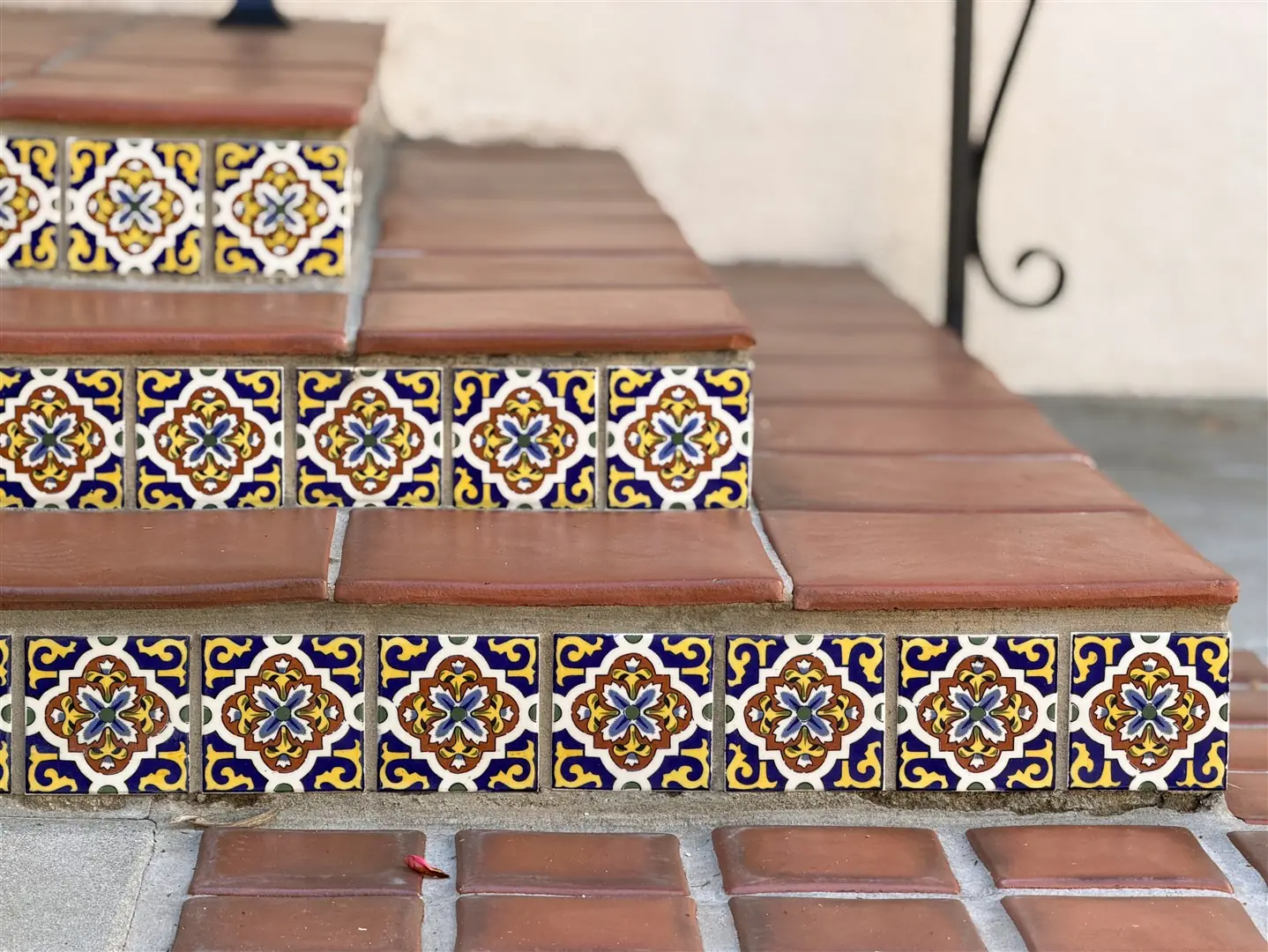 Decorative stair tile and terracotta treads at 1239 Geneva Street