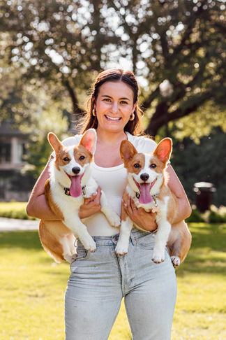 Girl holding her two dogs during an outdoor pet portrait session in Dallas, Texas