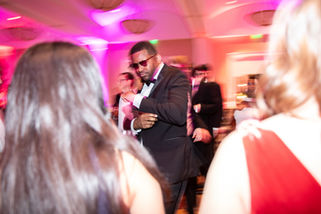 Employees dance at a company Christmas party in Dallas, Texas