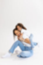 Mom and daughter play during a studio family portrait session in Dallas, Texas