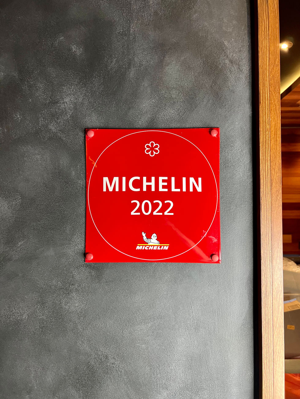 Michelin-starred restaurant with sustainable lime wash plaster and elegant decor.