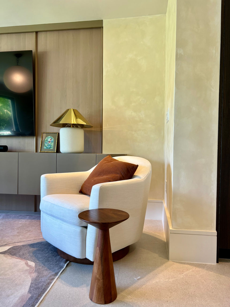 High-end living room with lime wash wall finishes and designer furniture.