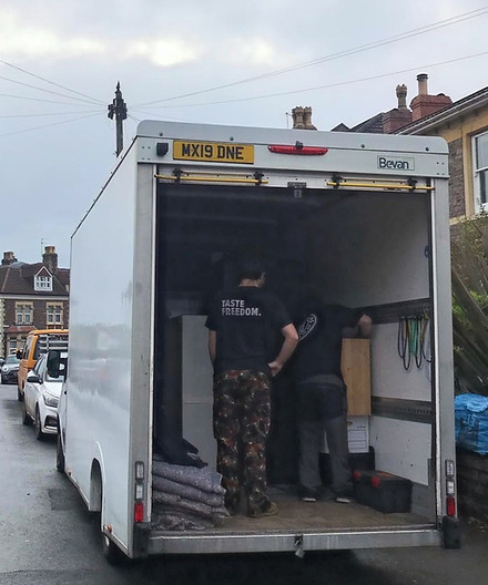 Two Movers Loading furniture into a Luton Van
