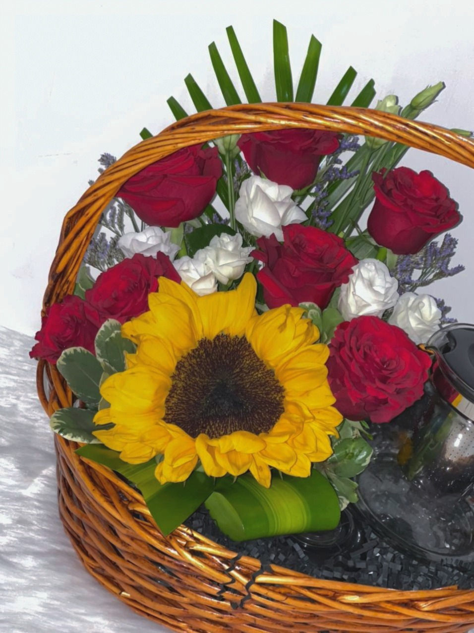 थंबनेल: Radiant Fresh Sunflower and Roses in a Basket with Tea Glass Pot