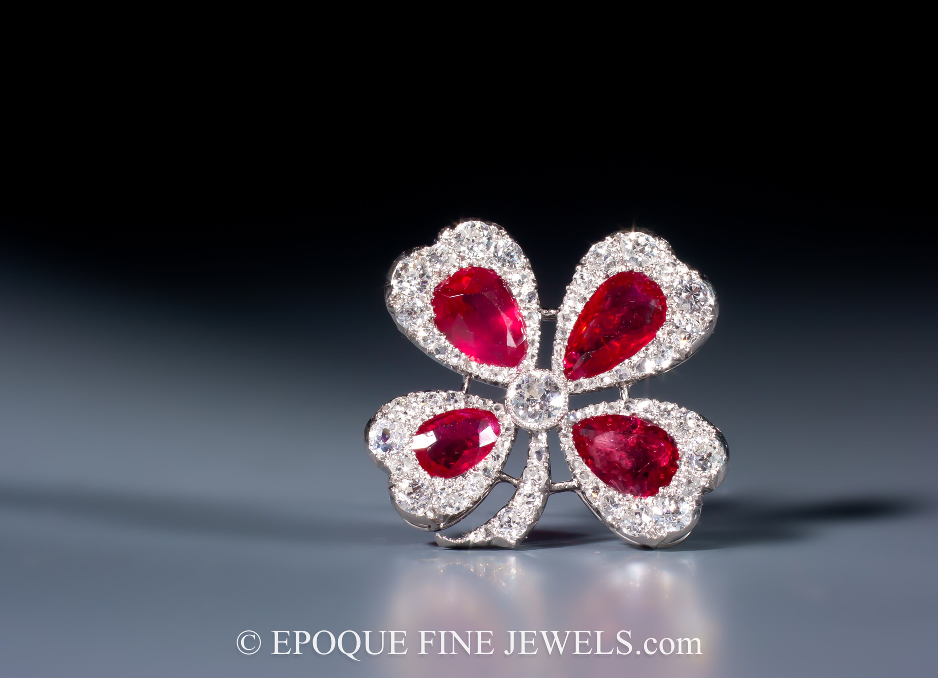 A very fine early 20th century ruby and diamond four-leaf clover brooch by Marzo