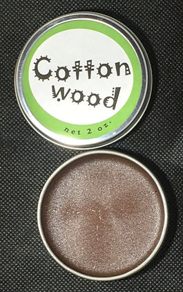 open tin of pure cottonwood salve