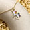 Thumbnail: White Rainbow Unicorn Enamel Golden Necklace & Earrings
