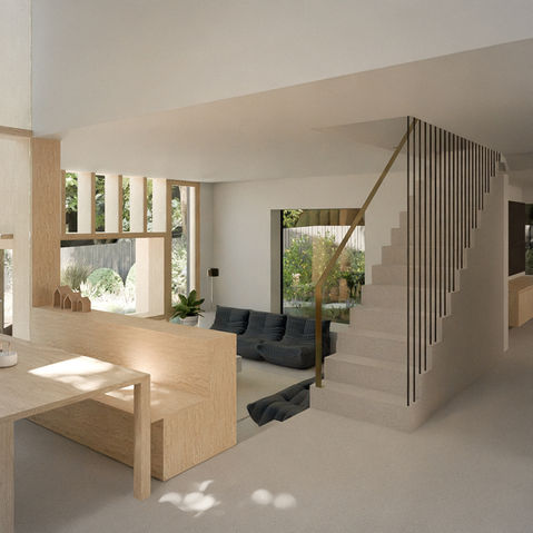 a living room with stairs leading up to the second floor