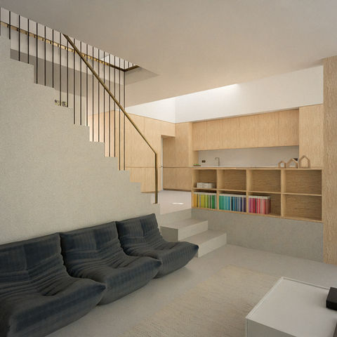 a living room with a couch and stairs leading up to a kitchen