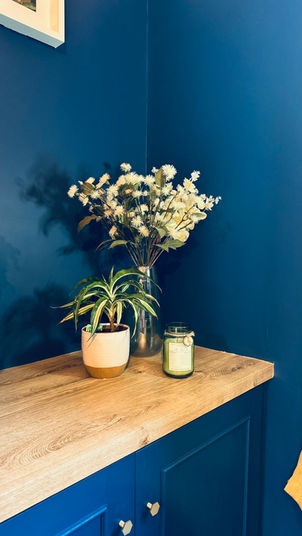 vase of flowers in navy lounge