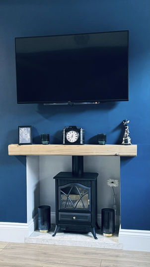 electric fire in blue living room chimney breast