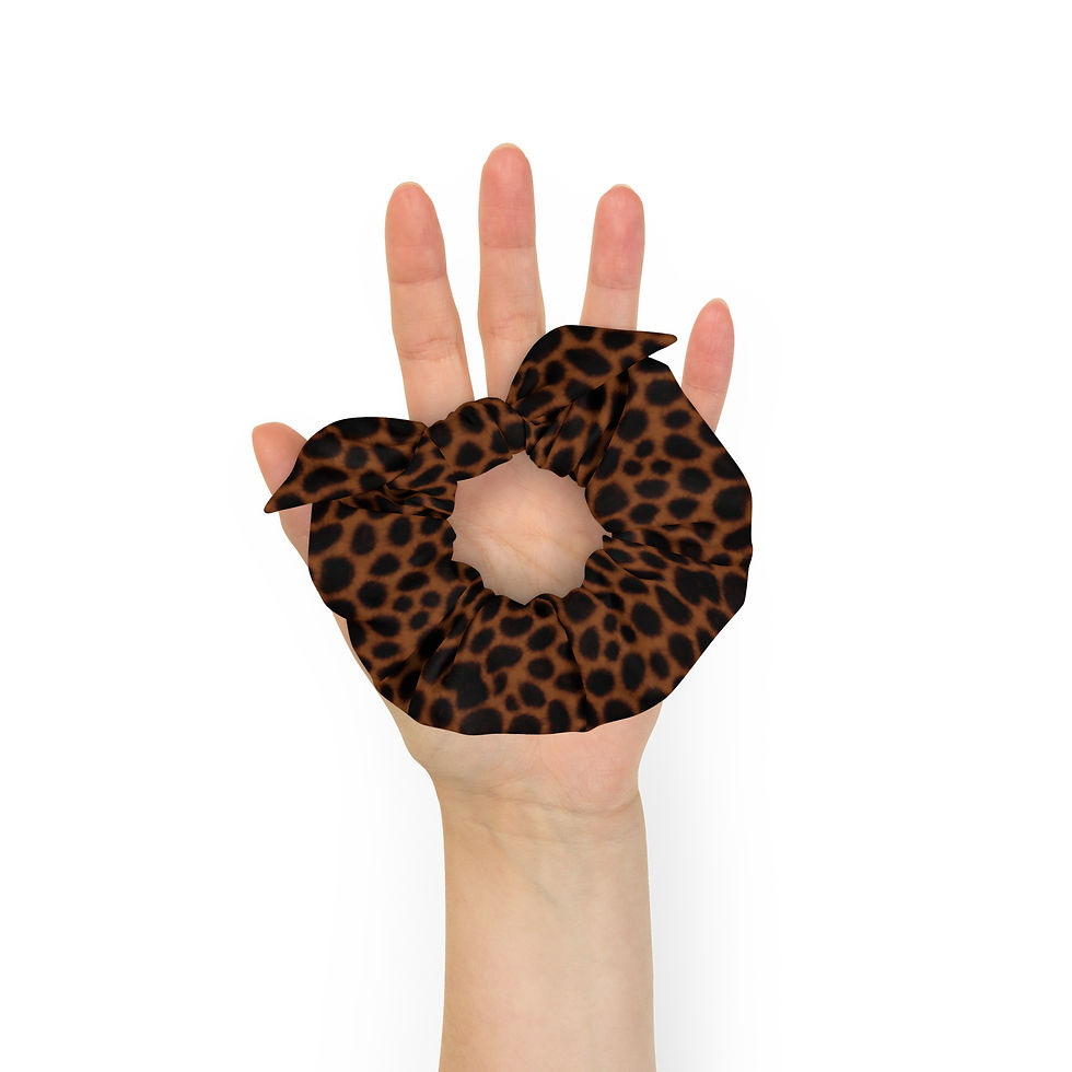 Thumbnail: Buy online Watercolor Brown Leopard Print Scrunchie. Perfect for all occasions, this trendy accessory completes your look!