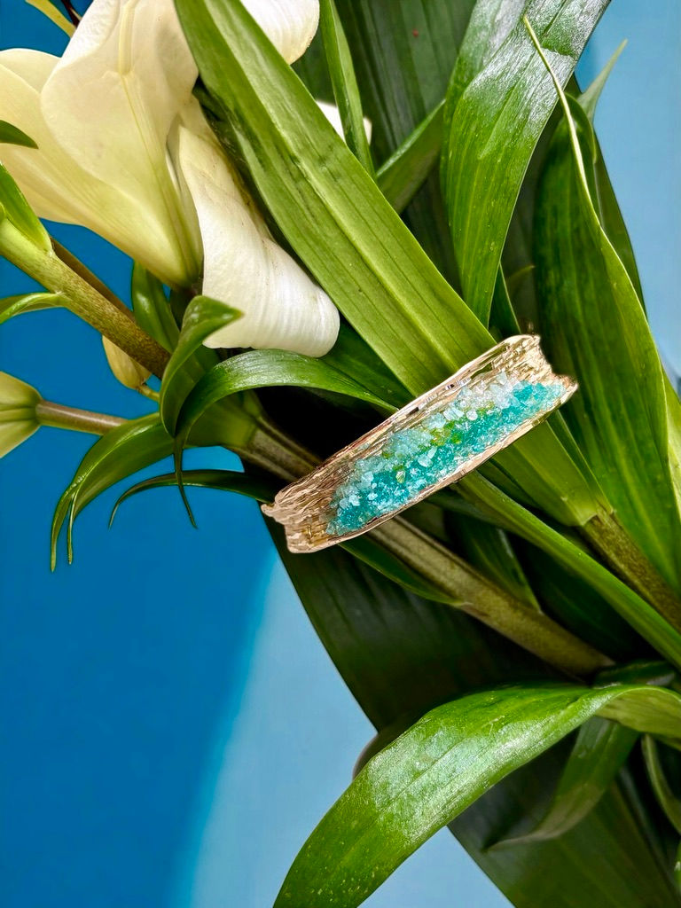 gold brass bracelet with aquamarine crystals close view