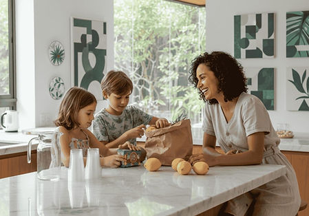 A proud mother watches her excited kids launch their first lemonade stand business