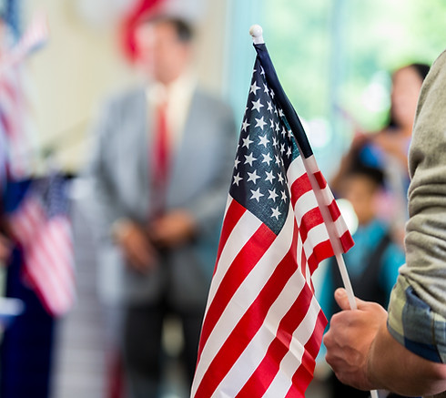 person holding an American flag