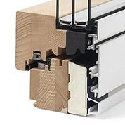 Cross-section of Tekno Termo model wood-aluminium windows and French doors highlighting the extra thickness